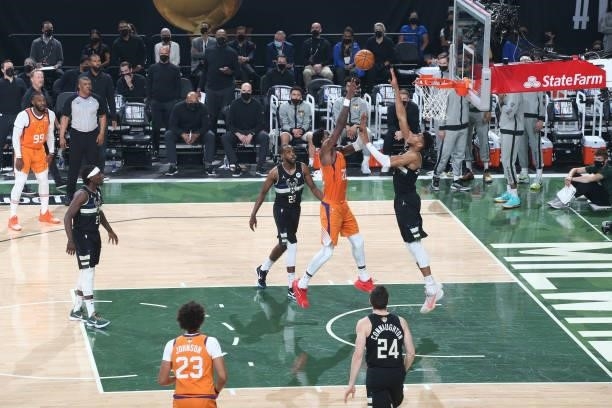 Giannis Antetokounmpo of the Milwaukee Bucks blocks the ball against the Phoenix Suns during Game Six of the 2021 NBA Finals on July 20, 2021 at the...