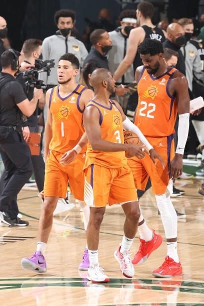 Chris Paul talks with Devin Booker and Deandre Ayton of the Phoenix Suns during Game Six of the 2021 NBA Finals on July 20, 2021 at the Fiserv Forum...