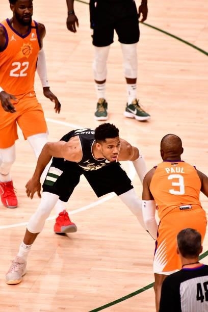 Giannis Antetokounmpo of the Milwaukee Bucks plays defense against Chris Paul of the Phoenix Suns during Game Six of the 2021 NBA Finals on July 20,...