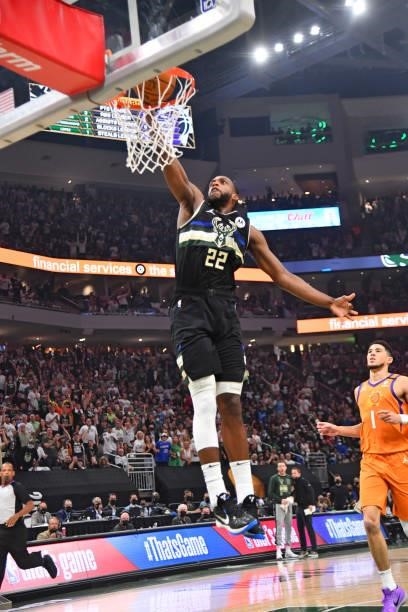 Khris Middleton of the Milwaukee Bucks dunks the ball against the Phoenix Suns during Game Six of the 2021 NBA Finals on July 20, 2021 at Fiserv...