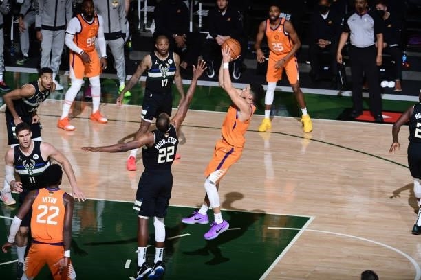 Devin Booker of the Phoenix Suns shoots the ball during the game against the Milwaukee Bucks during Game Six of the 2021 NBA Finals on July 20, 2021...