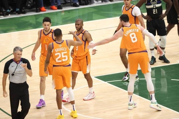 Chris Paul of the Phoenix Suns high fives Mikal Bridges of the Phoenix Suns and Frank Kaminsky of the Phoenix Suns during Game Six of the 2021 NBA...