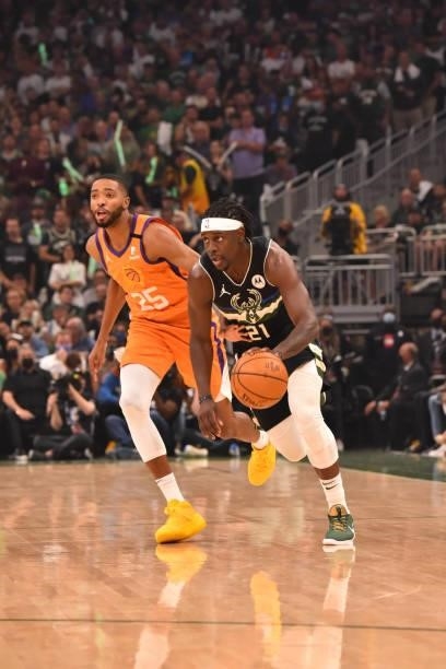 Jrue Holiday of the Milwaukee Bucks handles the ball against the Phoenix Suns during Game Six of the 2021 NBA Finals on July 20, 2021 at Fiserv Forum...