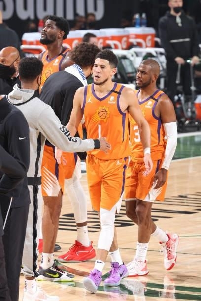 Devin Booker and Chris Paul of the Phoenix Suns hi-five their teammates during Game Six of the 2021 NBA Finals on July 20, 2021 at the Fiserv Forum...