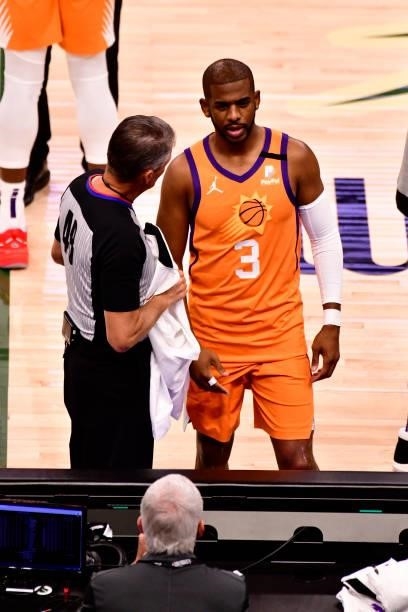 Referee, Scott Foster talks with Chris Paul of the Phoenix Suns before the game against the Milwaukee Bucks during Game Six of the 2021 NBA Finals on...