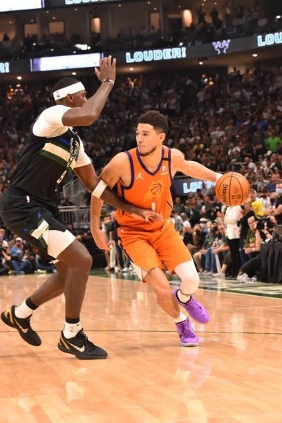 Devin Booker of the Phoenix Suns handles the ball against the Milwaukee Bucks during Game Six of the 2021 NBA Finals on July 20, 2021 at Fiserv Forum...