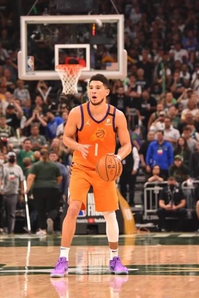 Devin Booker of the Phoenix Suns handles the ball against the Milwaukee Bucks during Game Six of the 2021 NBA Finals on July 20, 2021 at Fiserv Forum...
