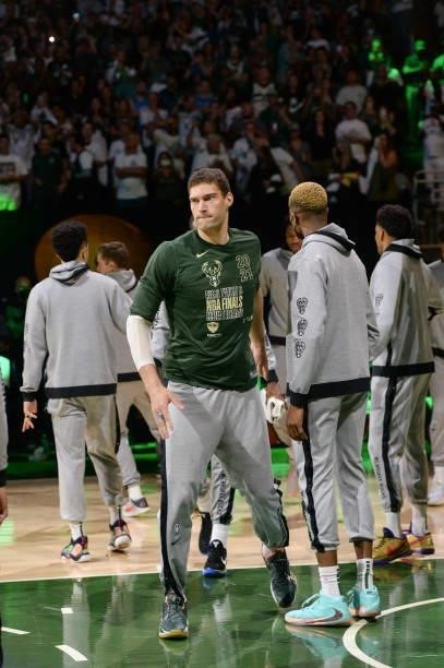 Brook Lopez of the Milwaukee Bucks high fives Mamadi Diakite of the Milwaukee Bucks before the game against the Phoenix Suns during Game Six of the...