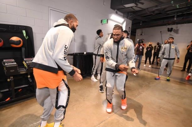 Mikal Bridges of the Phoenix Suns greets Jae Crowder of the Phoenix Suns before the game against the Milwaukee Bucks during Game Six of the 2021 NBA...