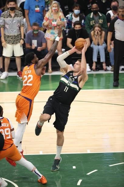 Brook Lopez of the Milwaukee Bucks shoots the ball against the Phoenix Suns during Game Six of the 2021 NBA Finals on July 20, 2021 at Fiserv Forum...