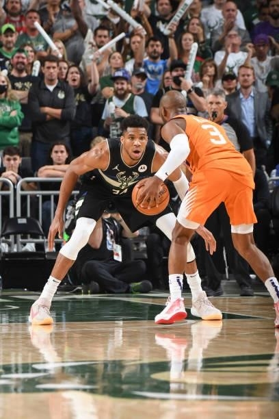 Giannis Antetokounmpo of the Milwaukee Bucks plays defense as Chris Paul of the Phoenix Suns handles the ball during Game Six of the 2021 NBA Finals...