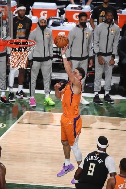 Devin Booker of the Phoenix Suns drives to the basket against the Milwaukee Bucks during Game Six of the 2021 NBA Finals on July 20, 2021 at the...