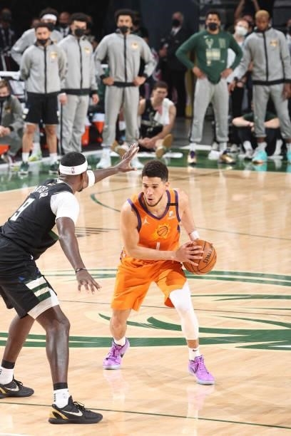 Devin Booker of the Phoenix Suns dribbles the ball during Game Six of the 2021 NBA Finals on July 20, 2021 at the Fiserv Forum in Milwaukee,...
