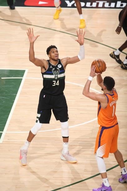 Giannis Antetokounmpo of the Milwaukee Bucks plays defense on Devin Booker of the Phoenix Suns during Game Six of the 2021 NBA Finals on July 20,...