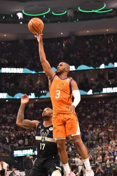 Chris Paul of the Phoenix Suns shoots the ball against P.J. Tucker of the Milwaukee Bucks during Game Six of the 2021 NBA Finals on July 20, 2021 at...