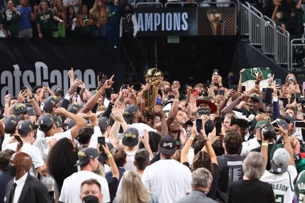 The Milwaukee Bucks hold the Larry O'Brien Trophy after winning Game Six of the 2021 NBA Finals on July 20, 2021 at the Fiserv Forum in Milwaukee,...