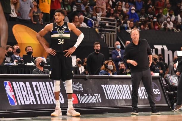 Giannis Antetokounmpo of the Milwaukee Bucks and Head Coach Mike Budenholzer of the Milwaukee Bucks look on during Game Six of the 2021 NBA Finals on...