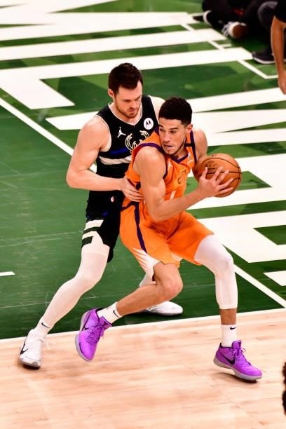 Devin Booker of the Phoenix Suns handles the ball against the Milwaukee Bucks during Game Six of the 2021 NBA Finals on July 20, 2021 at the Fiserv...