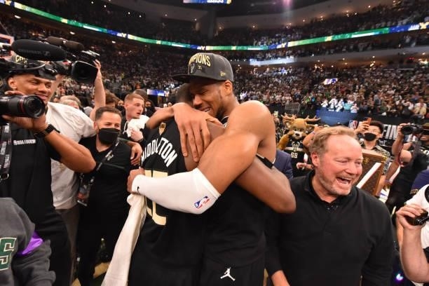 Khris Middleton of the Milwaukee Bucks and Giannis Antetokounmpo of the Milwaukee Bucks hug after winning Game Six of the 2021 NBA Finals against the...