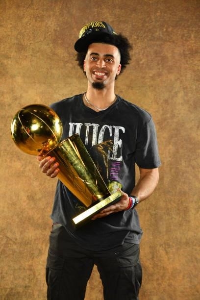 Jordan Nwora of the Milwaukee Bucks poses for a portrait with the Larry O'Brien Trophy after winning Game Six of the 2021 NBA Finals against the...