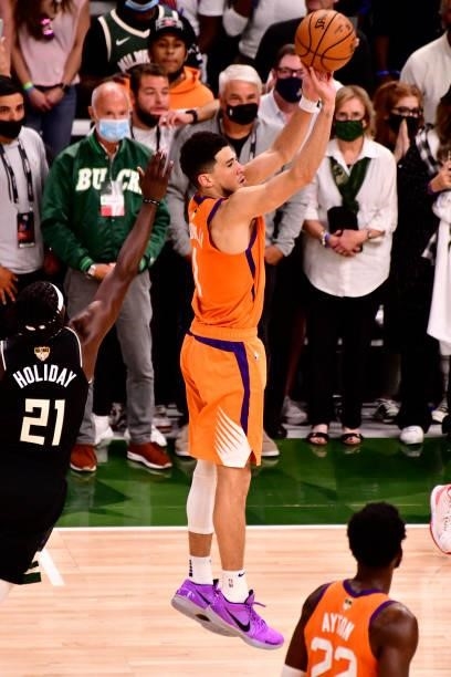 Devin Booker of the Phoenix Suns shoots the ball against the Milwaukee Bucks during Game Six of the 2021 NBA Finals on July 20, 2021 at the Fiserv...