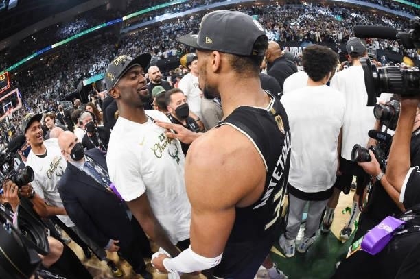 Giannis Antetokounmpo of the Milwaukee Bucks talks to Bobby Portis of the Milwaukee Bucks after defeating the Phoenix Suns in Game Six to win the...