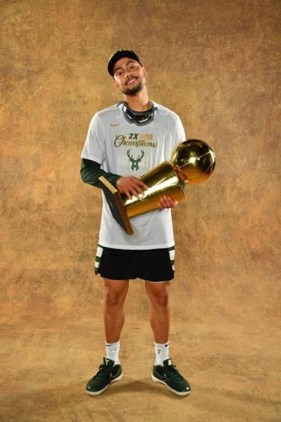 Bryn Forbes of the Milwaukee Bucks poses for a portrait with the Larry O'Brien Trophy after winning Game Six of the 2021 NBA Finals against the...