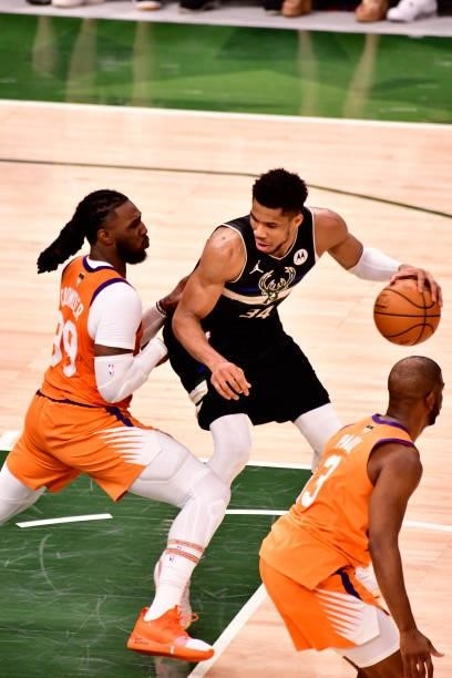 Giannis Antetokounmpo of the Milwaukee Bucks handles the ball against the Phoenix Suns during Game Six of the 2021 NBA Finals on July 20, 2021 at the...