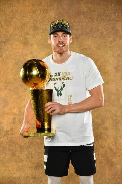 Pat Connaughton of the Milwaukee Bucks poses for a portrait with the Larry O'Brien Trophy after winning Game Six of the 2021 NBA Finals against the...