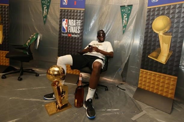 Khris Middleton of the Milwaukee Bucks celebrates with the Larry O'Brien Trophy after winning Game Six of the 2021 NBA Finals on July 20, 2021 at the...