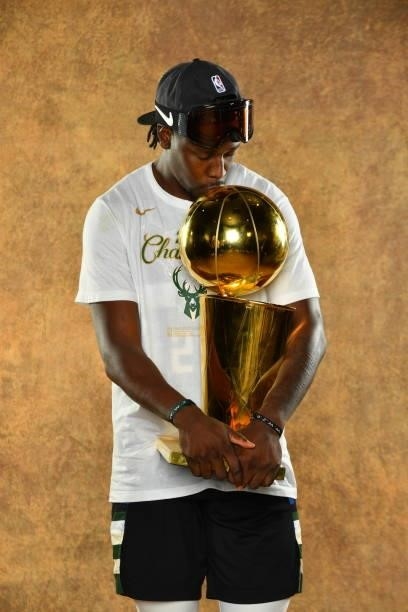 Jrue Holiday of the Milwaukee Bucks poses for a portrait with the Larry O'Brien Trophy after winning Game Six of the 2021 NBA Finals against the...