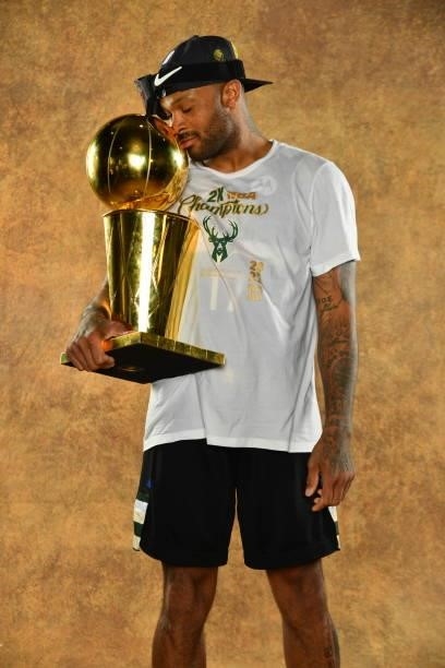 Tucker of the Milwaukee Bucks poses for a portrait with the Larry O'Brien Trophy after winning Game Six of the 2021 NBA Finals against the Phoenix...
