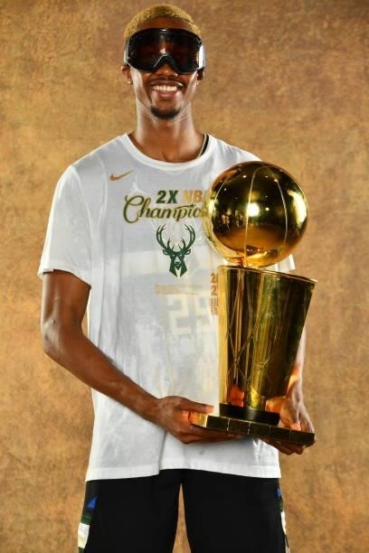 Mamadi Diakite of the Milwaukee Bucks poses for a portrait with the Larry O'Brien Trophy after winning Game Six of the 2021 NBA Finals against the...