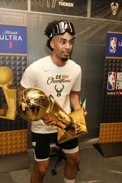 Jordan Nwora of the Milwaukee Bucks celebrates with the Larry O'Brien Trophy after winning Game Six of the 2021 NBA Finals on July 20, 2021 at the...