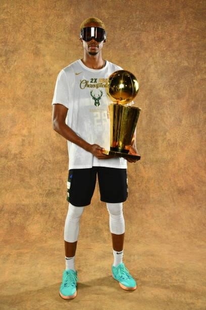 Mamadi Diakite of the Milwaukee Bucks poses for a portrait with the Larry O'Brien Trophy after winning Game Six of the 2021 NBA Finals against the...