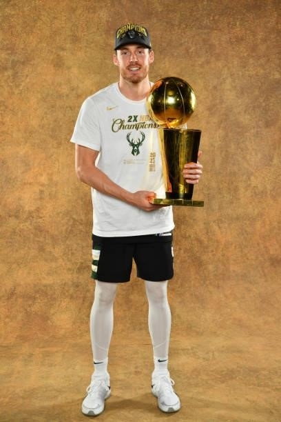 Pat Connaughton of the Milwaukee Bucks poses for a portrait with the Larry O'Brien Trophy after winning Game Six of the 2021 NBA Finals against the...