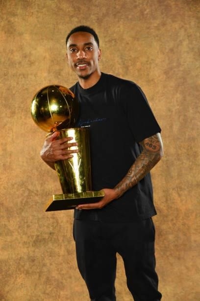 Jeff Teague of the Milwaukee Bucks poses for a portrait with the Larry O'Brien Trophy after winning Game Six of the 2021 NBA Finals against the...