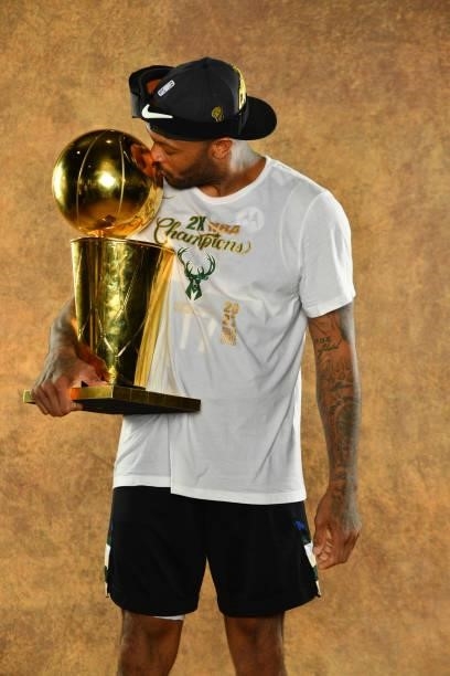 Tucker of the Milwaukee Bucks poses for a portrait with the Larry O'Brien Trophy after winning Game Six of the 2021 NBA Finals against the Phoenix...
