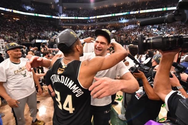 Giannis Antetokounmpo of the Milwaukee Bucks and Brook Lopez of the Milwaukee Bucks hug after winning Game Six of the 2021 NBA Finals against the...