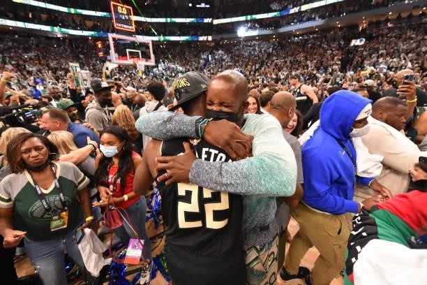 Khris Middleton of the Milwaukee Bucks and Former NBA Player, Michael Redd hug after winning Game Six of the 2021 NBA Finals against the Phoenix Suns...