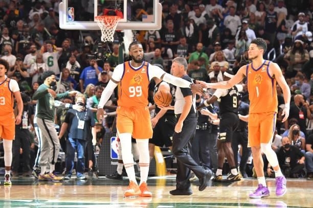 Jae Crowder of the Phoenix Suns and Devin Booker of the Phoenix Suns high-five during Game Six of the 2021 NBA Finals on July 20, 2021 at Fiserv...