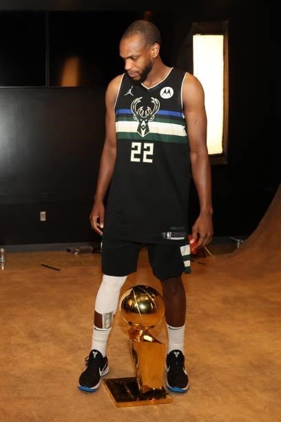 Khris Middleton of the Milwaukee Bucks poses with the Larry O'Brien Trophy after winning the 2021 NBA Finals on July 20, 2021 at the Fiserv Forum in...
