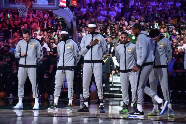 The Milwaukee Bucks stand for the National Anthem before Game Six of the 2021 NBA Finals on July 20, 2021 at Fiserv Forum in Milwaukee, Wisconsin....