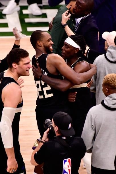 Khris Middleton and Jrue Holiday of the Milwaukee Bucks celebrate after winning Game Six of the 2021 NBA Finals against the Phoenix Suns on July 20,...