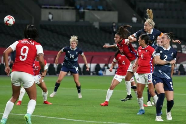 Britain's forward Nikita Parris heads the ball during the Tokyo 2020 Olympic Games women's group E first round football match between Great Britain...