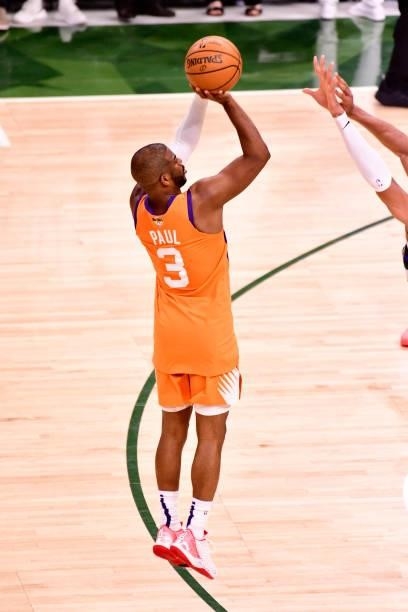 Chris Paul of the Phoenix Suns shoots a 3-pointer during the game against the Milwaukee Bucks during Game Six of the 2021 NBA Finals on July 20, 2021...