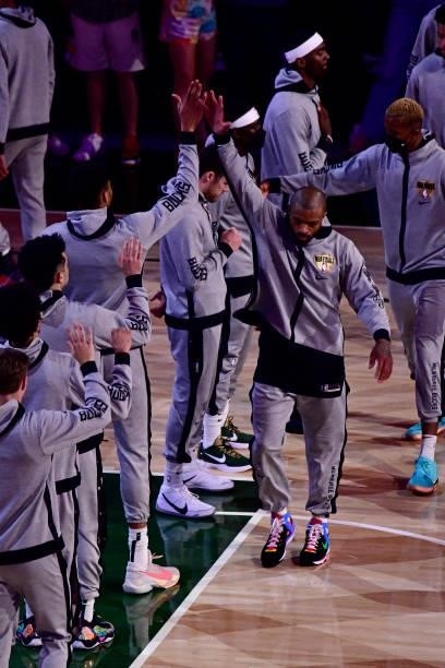 Tucker of the Milwaukee Bucks high fives his teammates before the game against the Phoenix Suns during Game Six of the 2021 NBA Finals on July 20,...