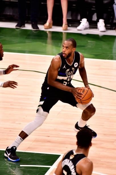 Khris Middleton of the Milwaukee Bucks handles the ball against the Phoenix Suns during Game Six of the 2021 NBA Finals on July 20, 2021 at the...
