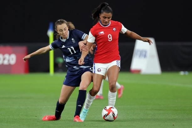 Britain's midfielder Caroline Weir challenges Chile's forward Maria Jose Urrutia during the Tokyo 2020 Olympic Games women's group E first round...