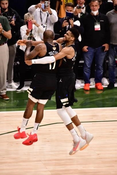 Tucker and Giannis Antetokounmpo of the Milwaukee Bucks celebrate after defeating the Phoenix Suns during Game Six of the 2021 NBA Finals on July 20,...